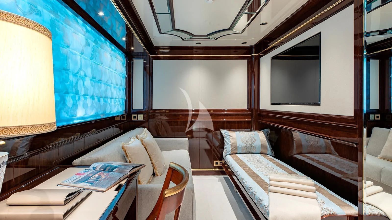 a room with a bed and a chair aboard LADY LENA Yacht for Sale