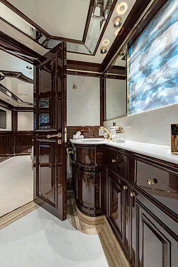 a bathroom with a large mirror aboard LADY LENA Yacht for Sale