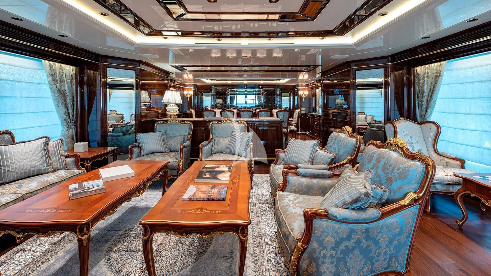 a room with a table chairs and a couch aboard LADY LENA Yacht for Sale