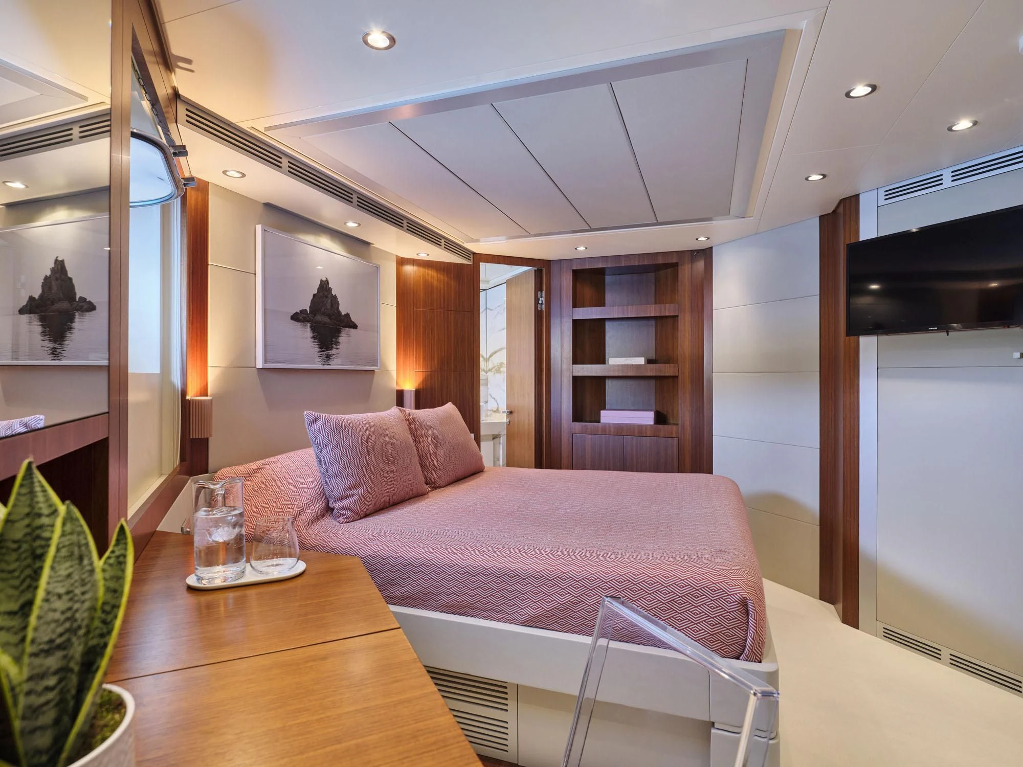 a bed in a room aboard BEYOND Yacht for Charter