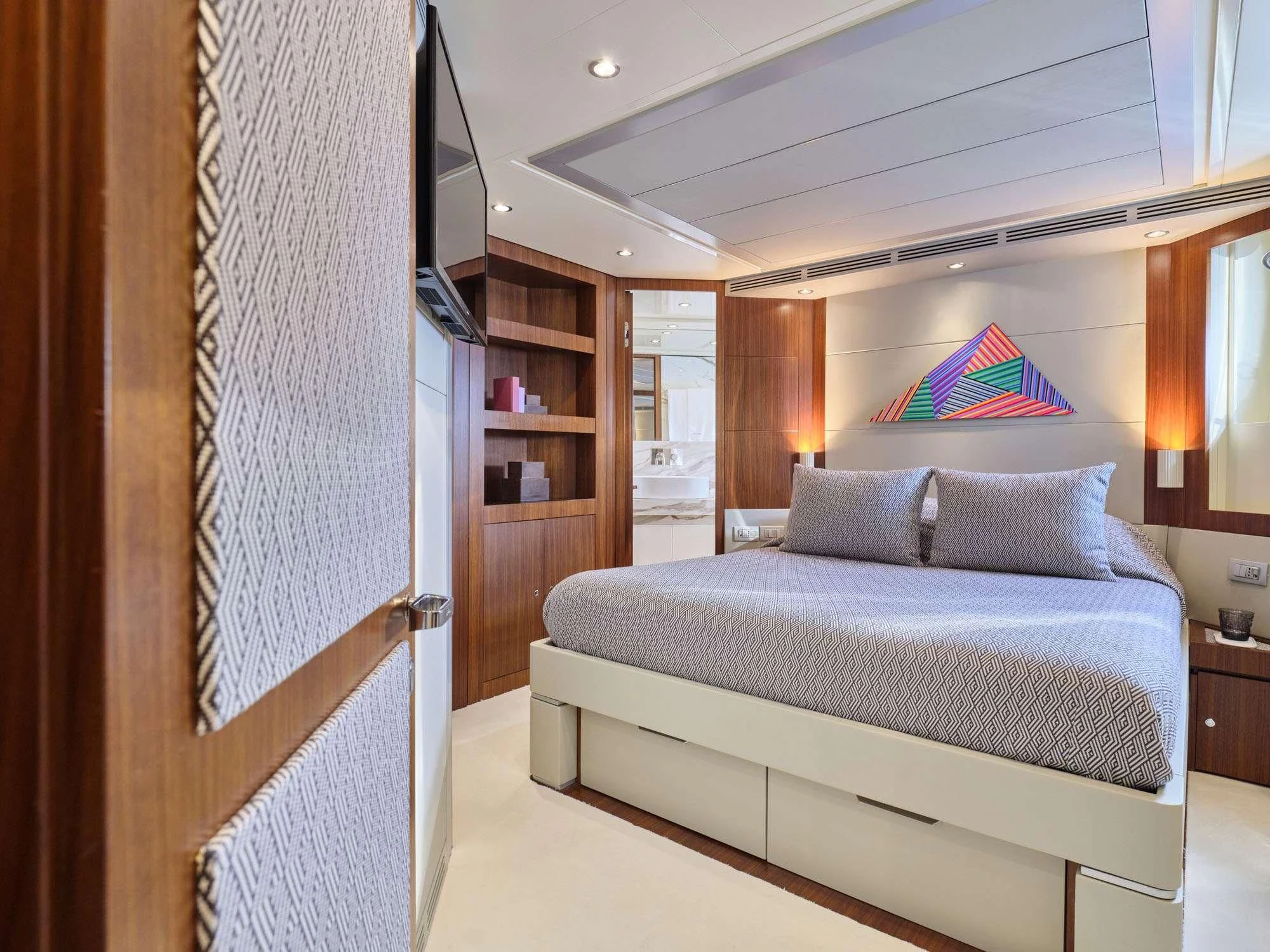 a bed in a room aboard BEYOND Yacht for Charter
