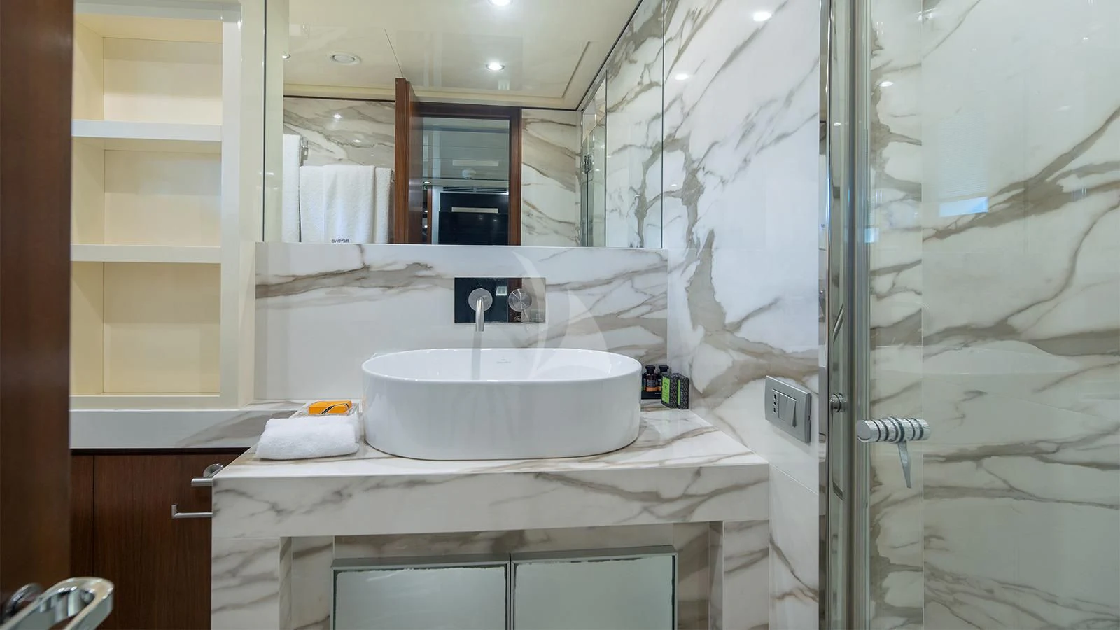 a bathroom with a sink and a mirror aboard BEYOND Yacht for Charter