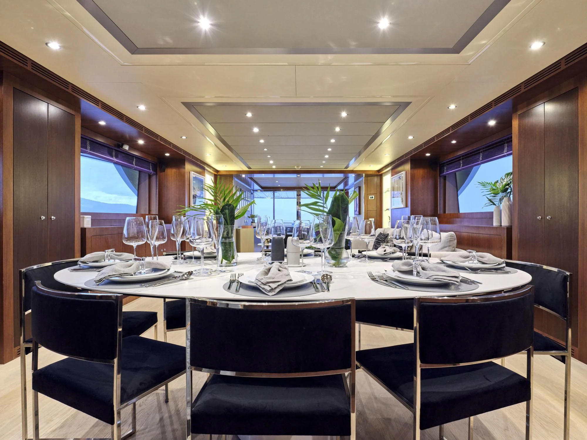 a table with wine glasses aboard BEYOND Yacht for Charter