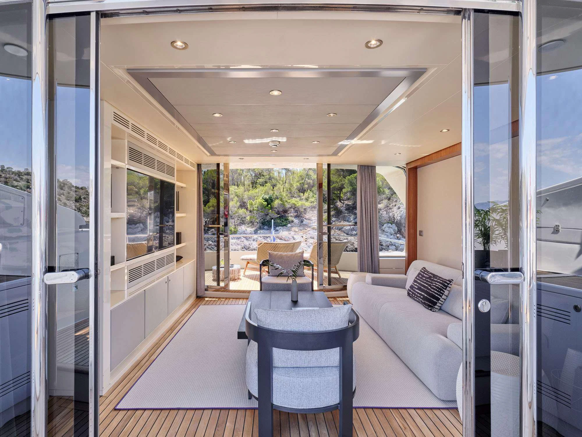 a room with a table and chairs aboard BEYOND Yacht for Charter