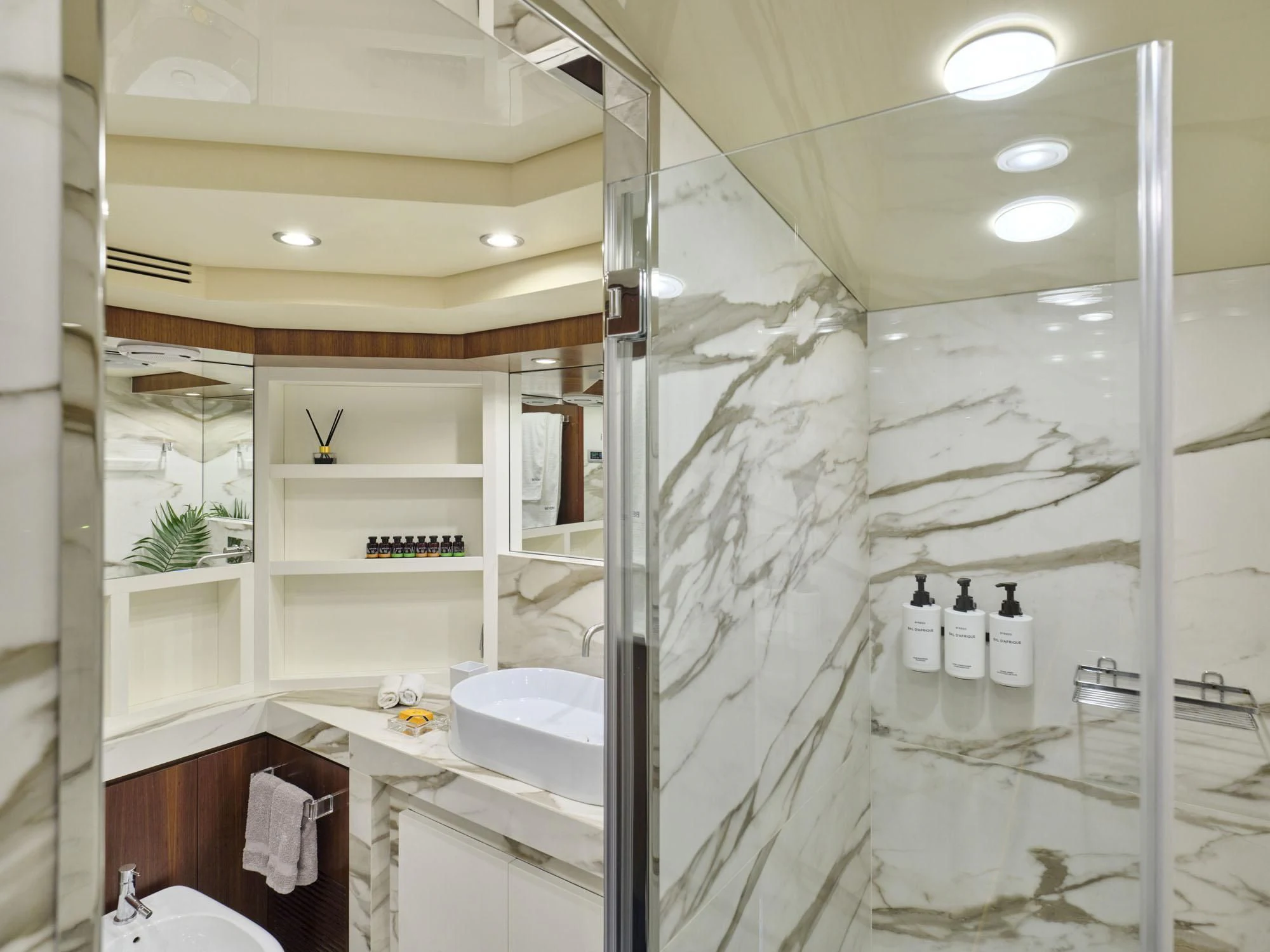 a bathroom with a glass shower aboard BEYOND Yacht for Charter