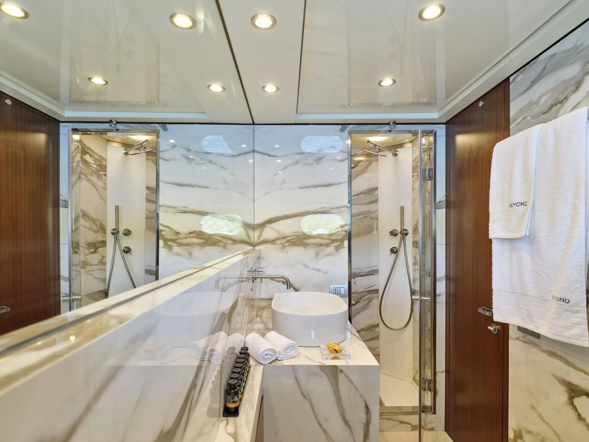 a bathroom with a sink and a mirror aboard BEYOND Yacht for Charter