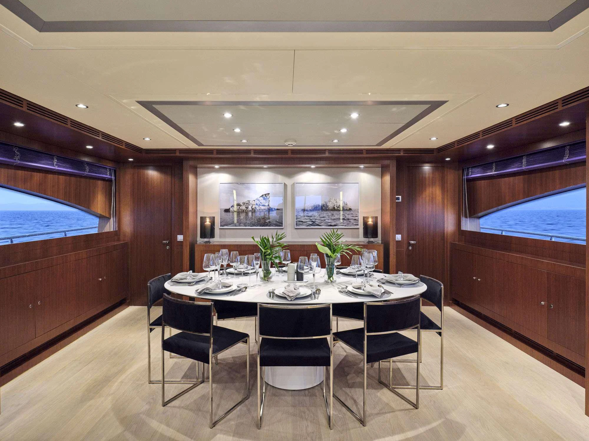 a dining table in a room aboard BEYOND Yacht for Charter