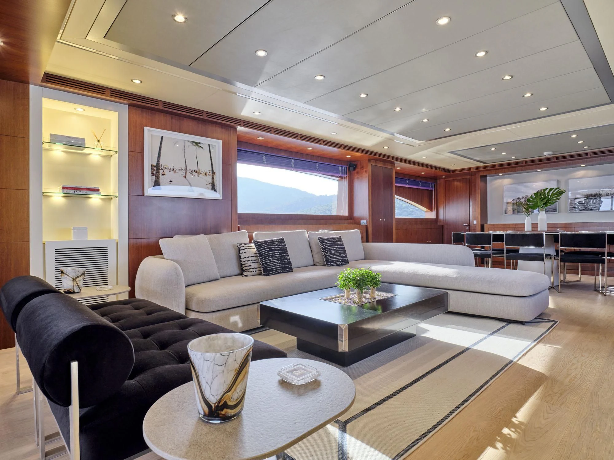 a living room with a large window aboard BEYOND Yacht for Charter