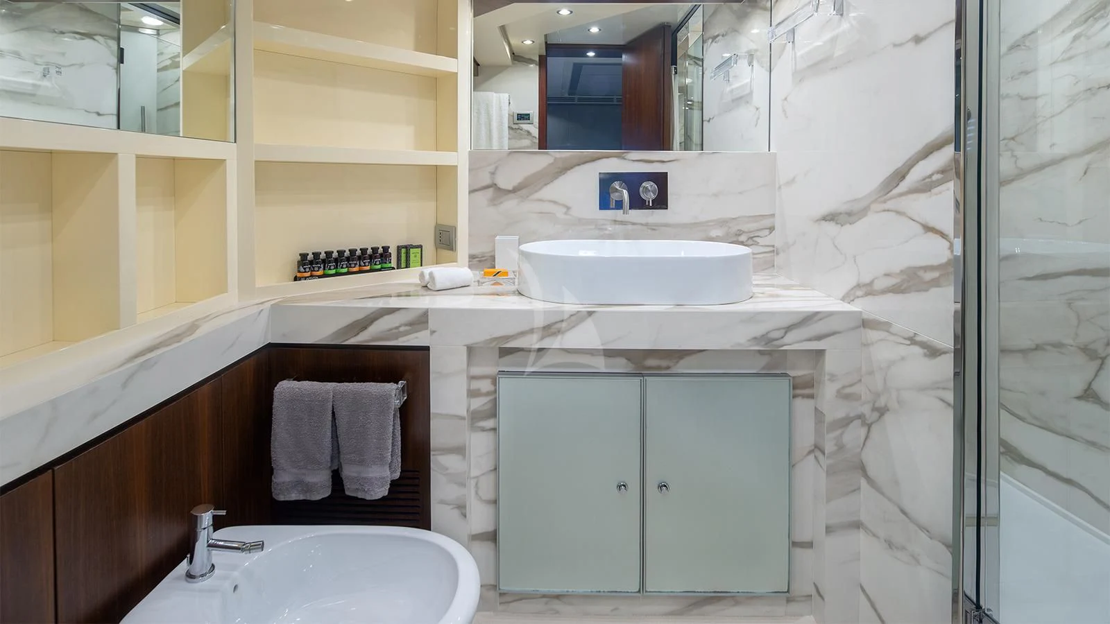 a bathroom with a sink and a mirror aboard BEYOND Yacht for Charter