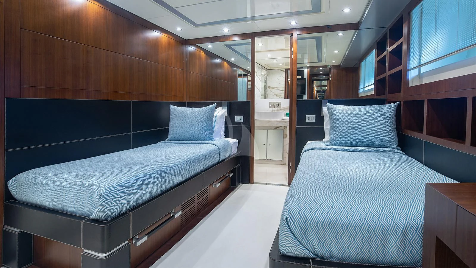 a room with two beds aboard BEYOND Yacht for Charter