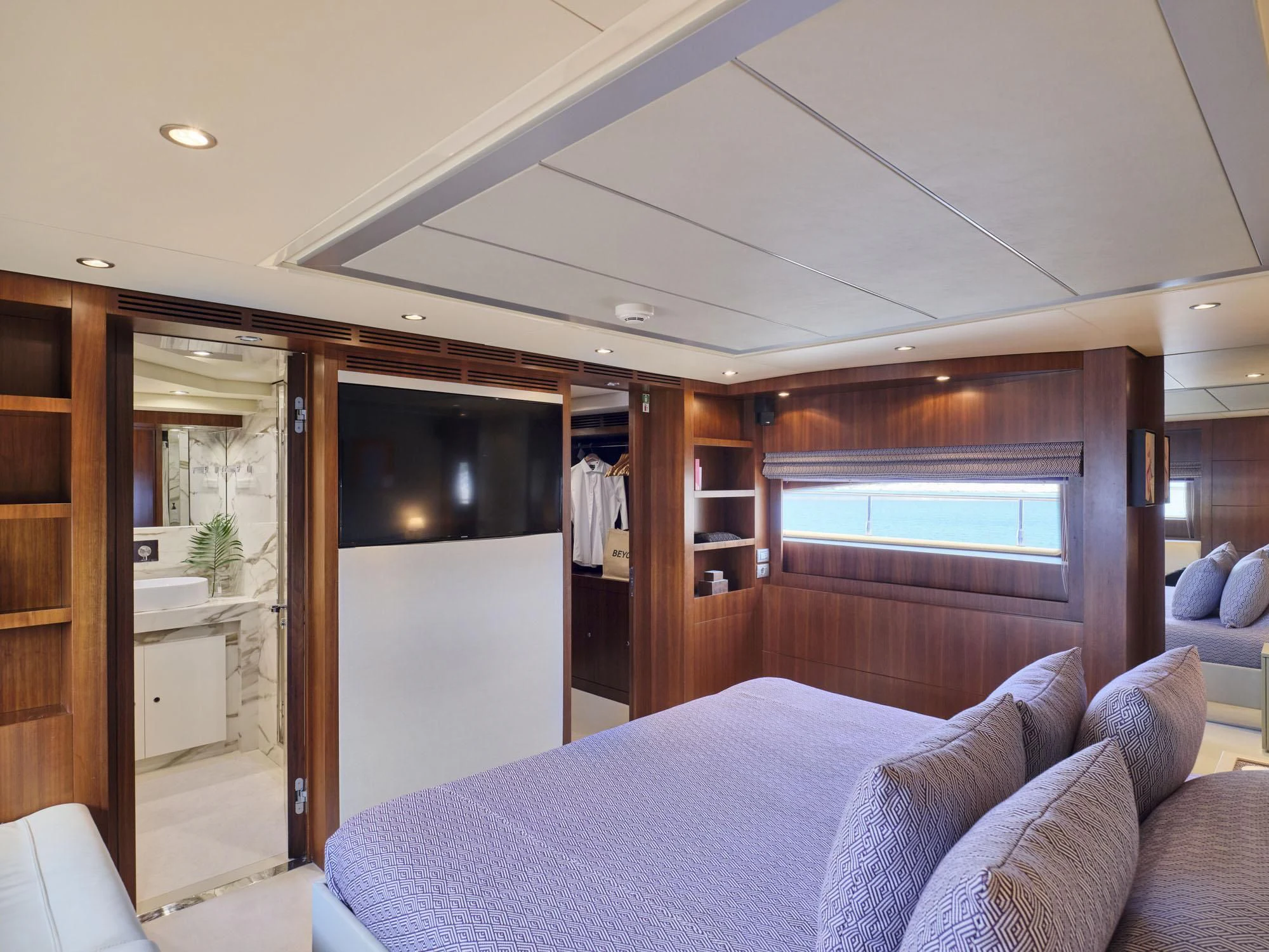 a bed in a room aboard BEYOND Yacht for Charter
