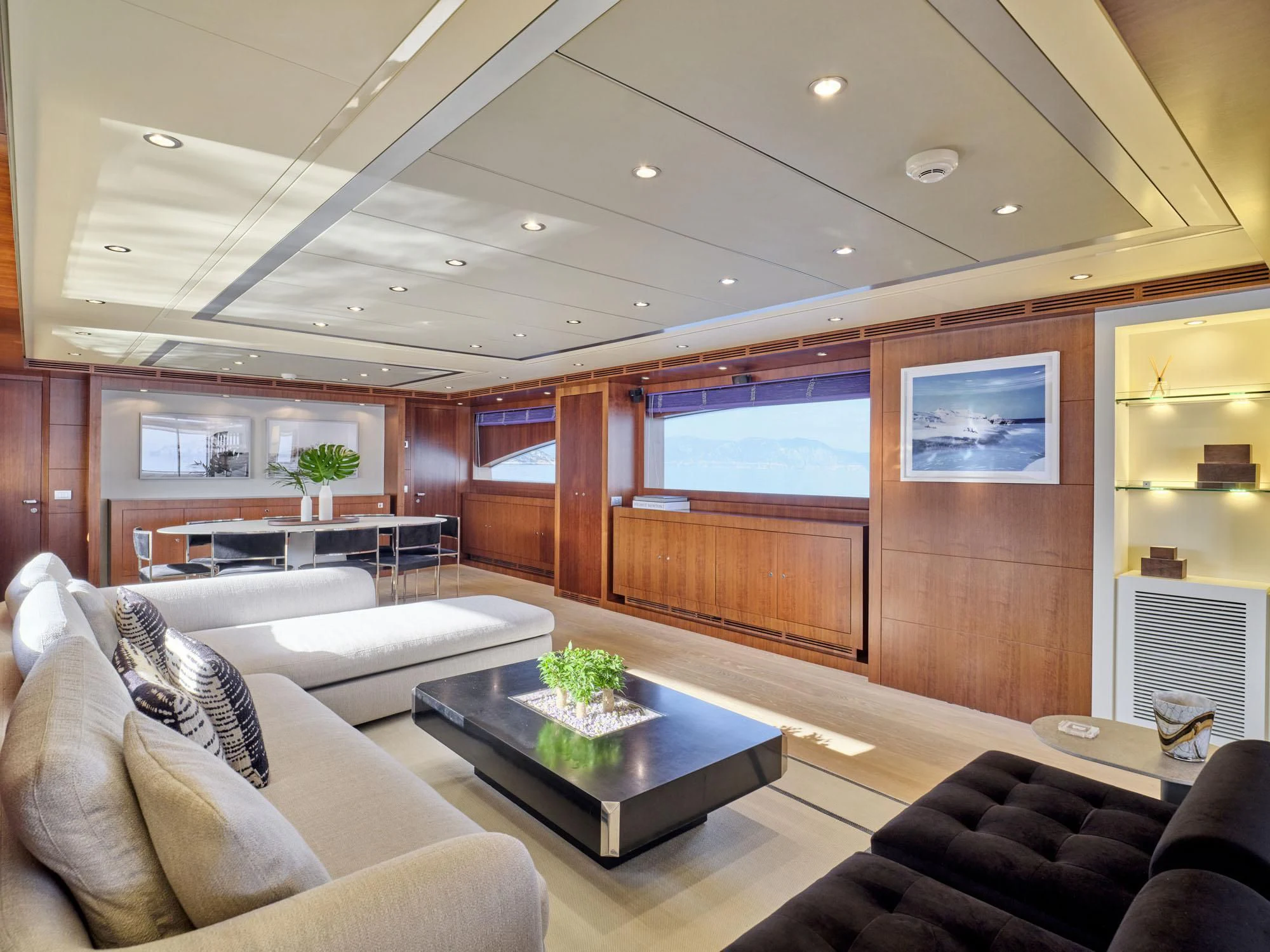 a living room with a wood paneled wall aboard BEYOND Yacht for Charter