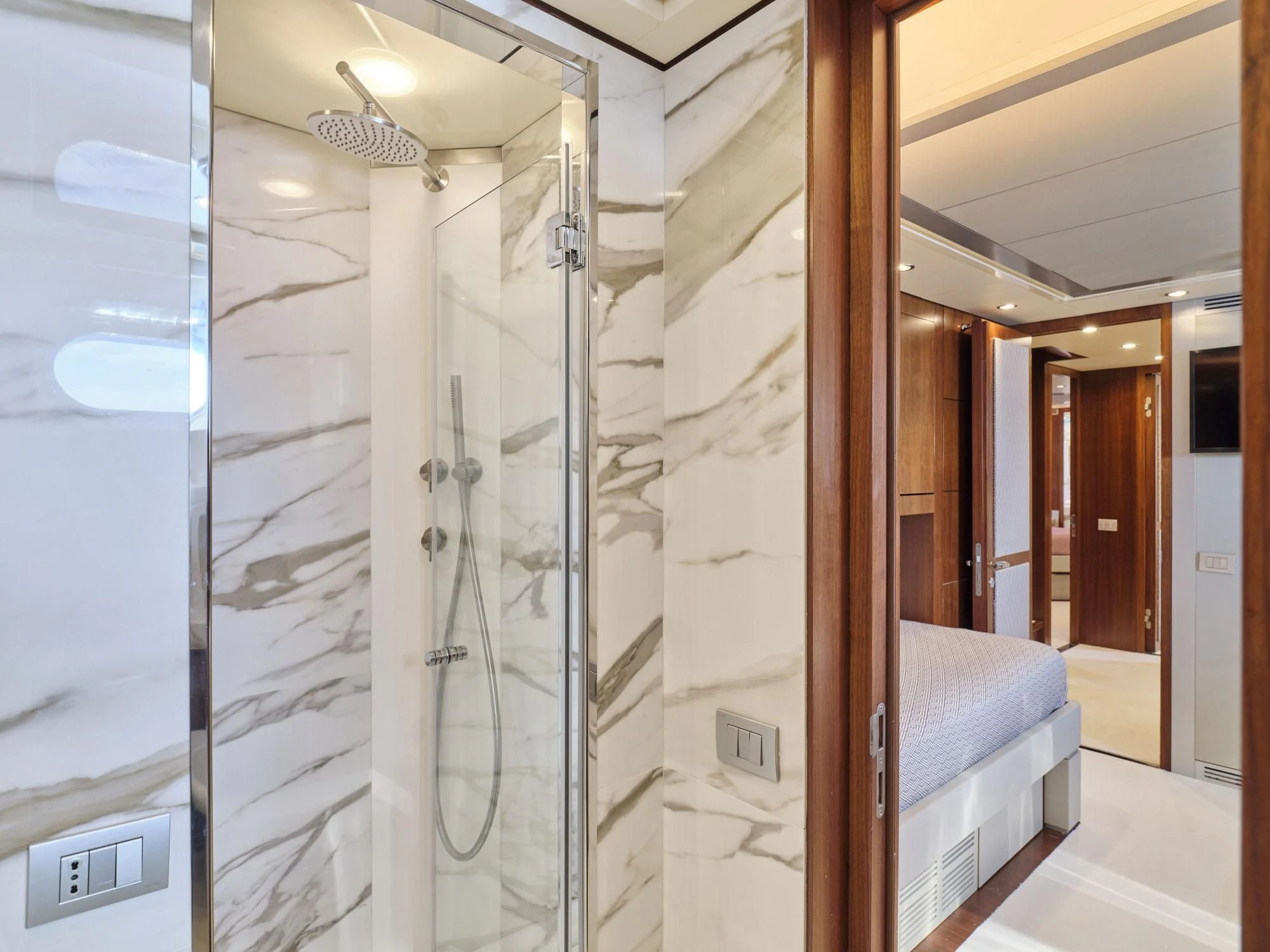 a bathroom with a glass shower aboard BEYOND Yacht for Charter