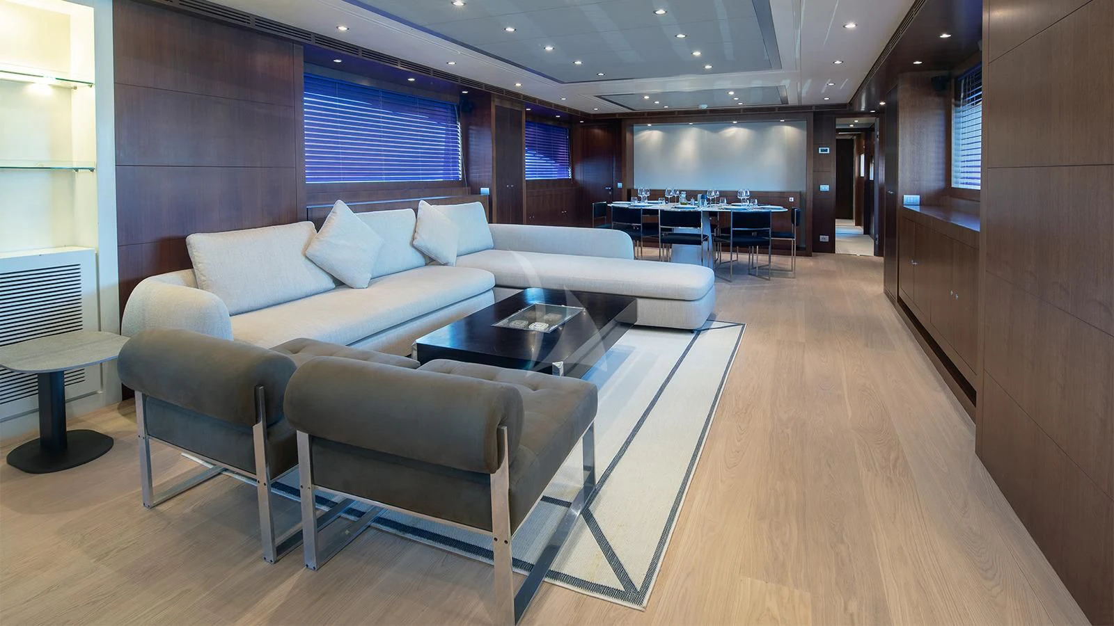 a room with a couch and a table aboard BEYOND Yacht for Charter