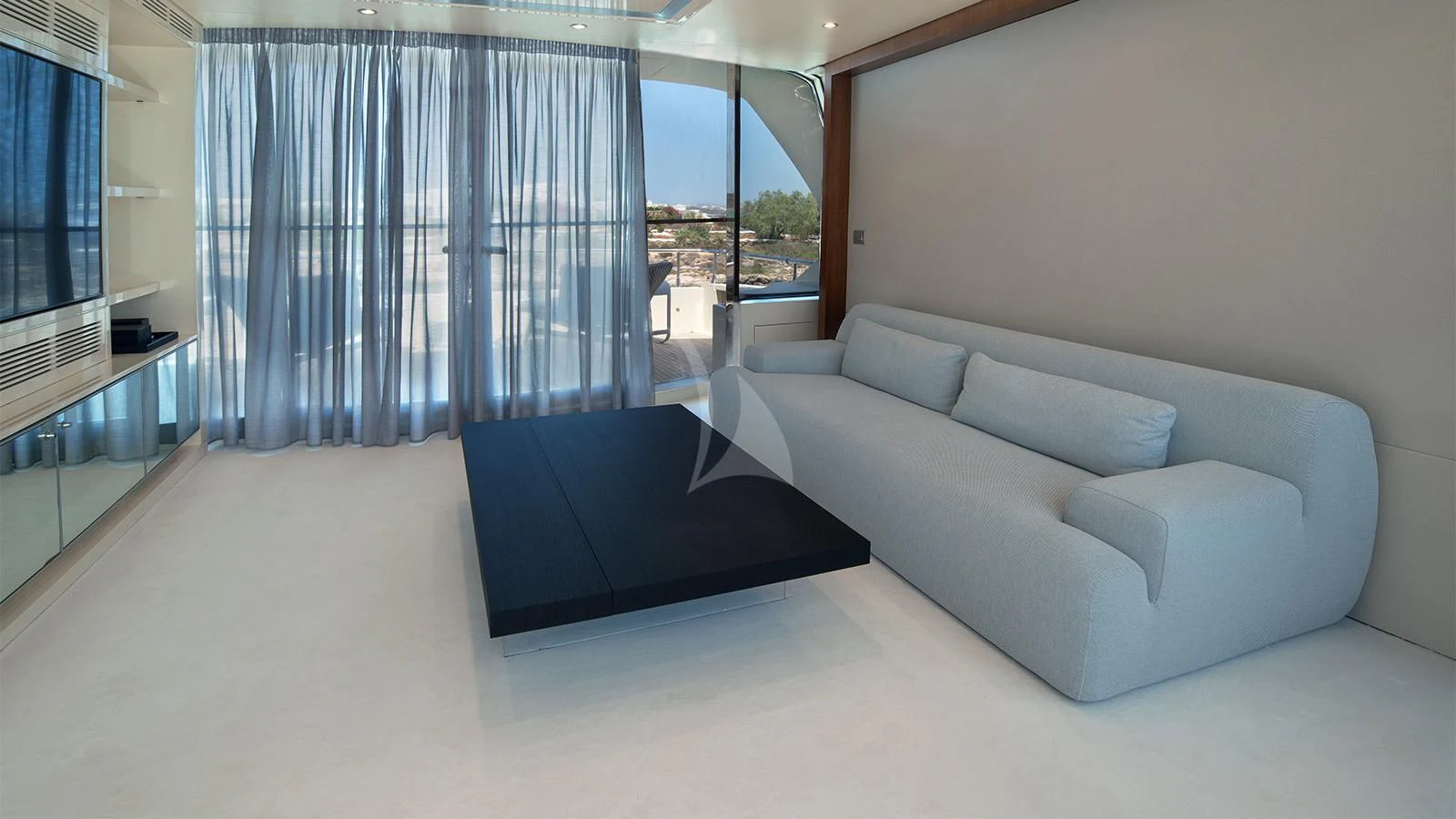 a room with a bed and a couch aboard BEYOND Yacht for Charter