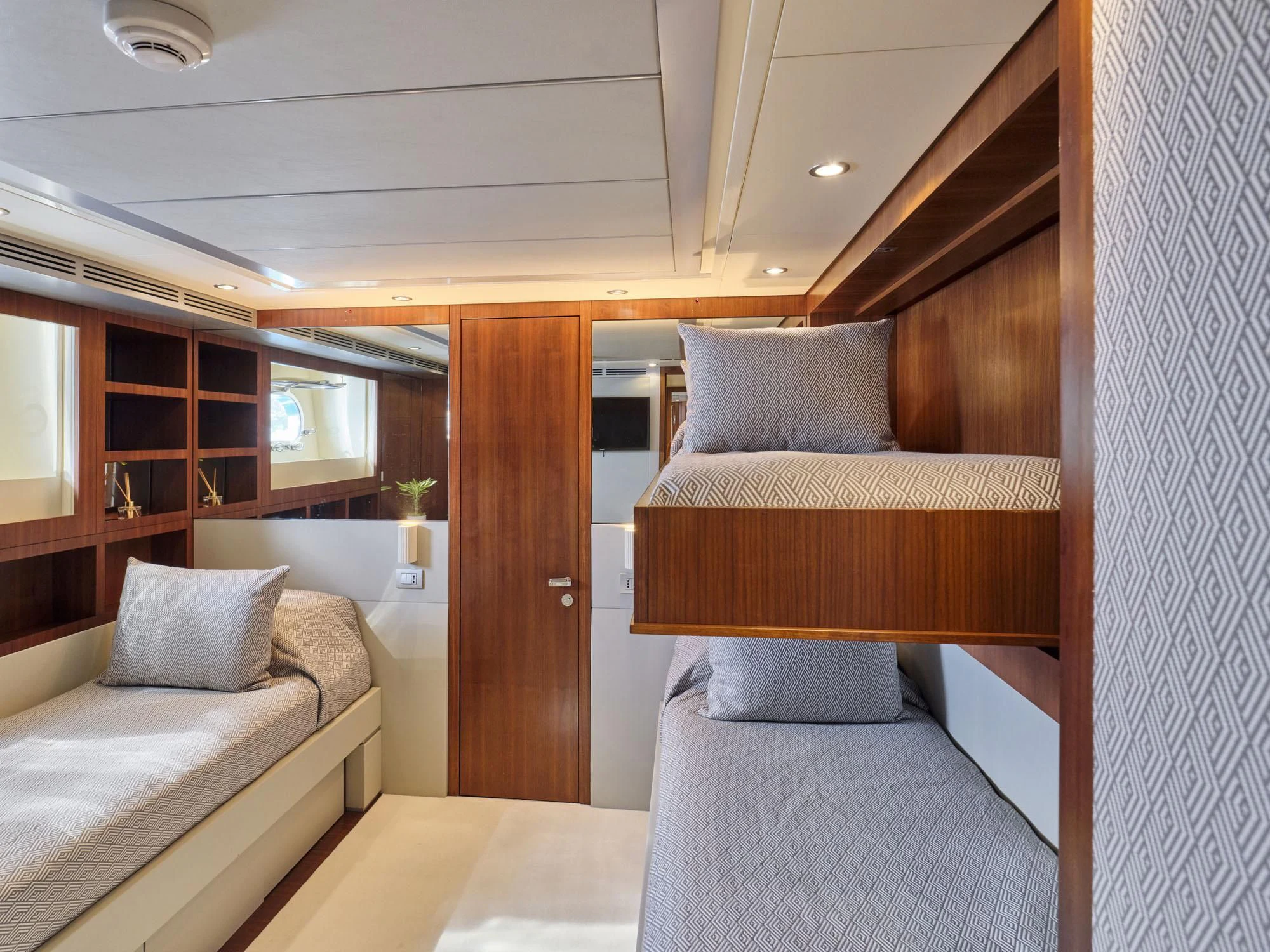 a room with two beds aboard BEYOND Yacht for Charter