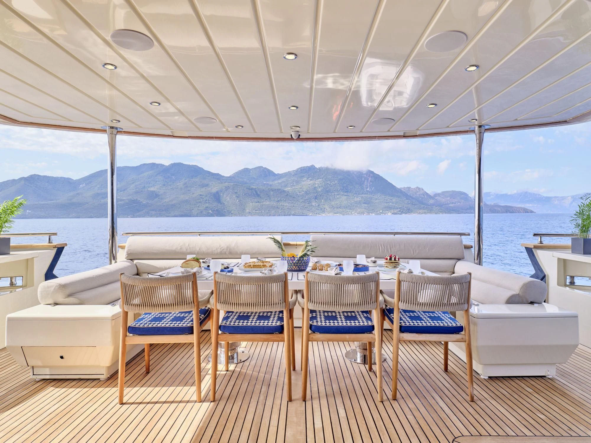 a table set for a meal aboard BEYOND Yacht for Charter