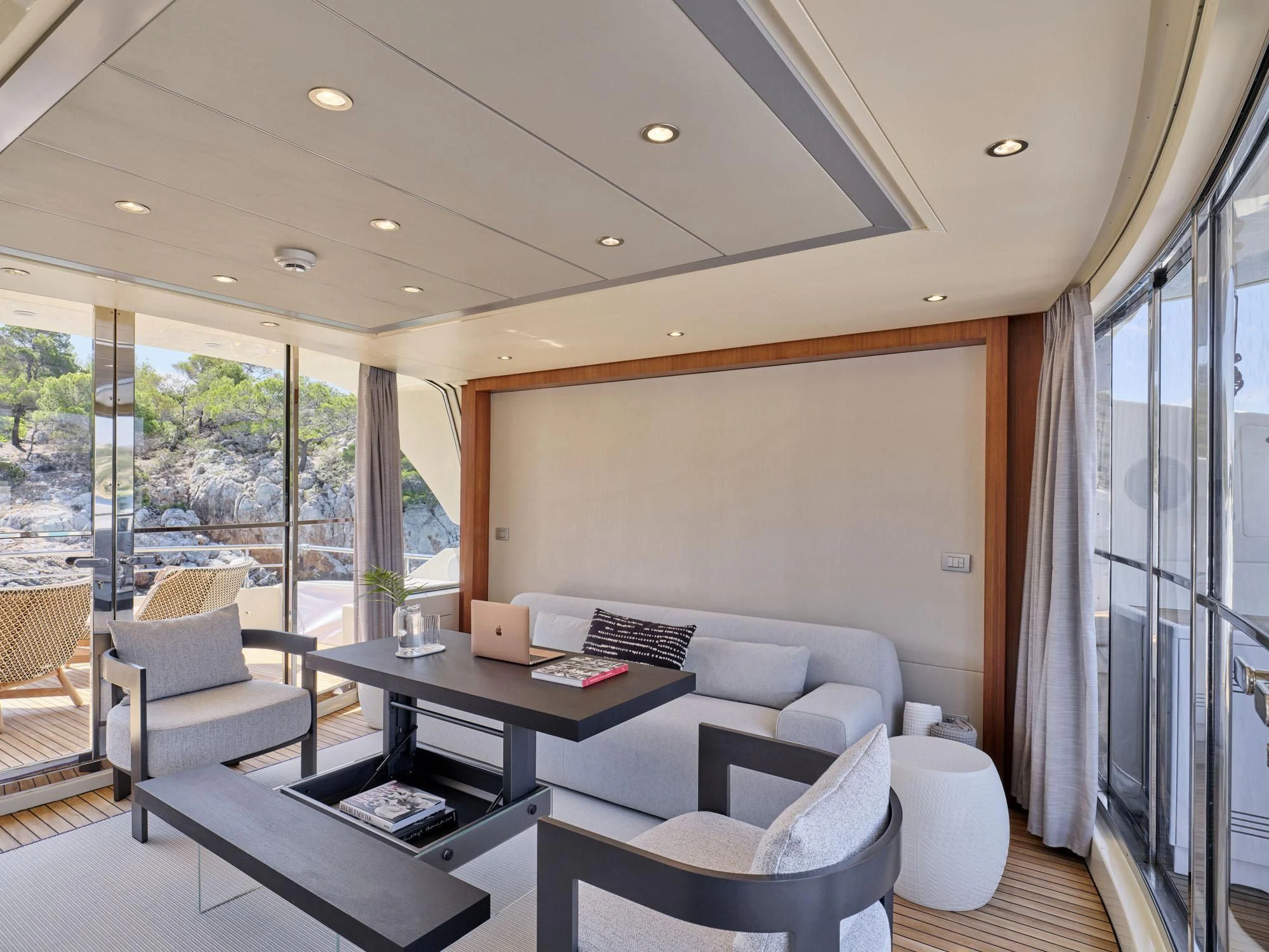 a room with a table and chairs aboard BEYOND Yacht for Charter