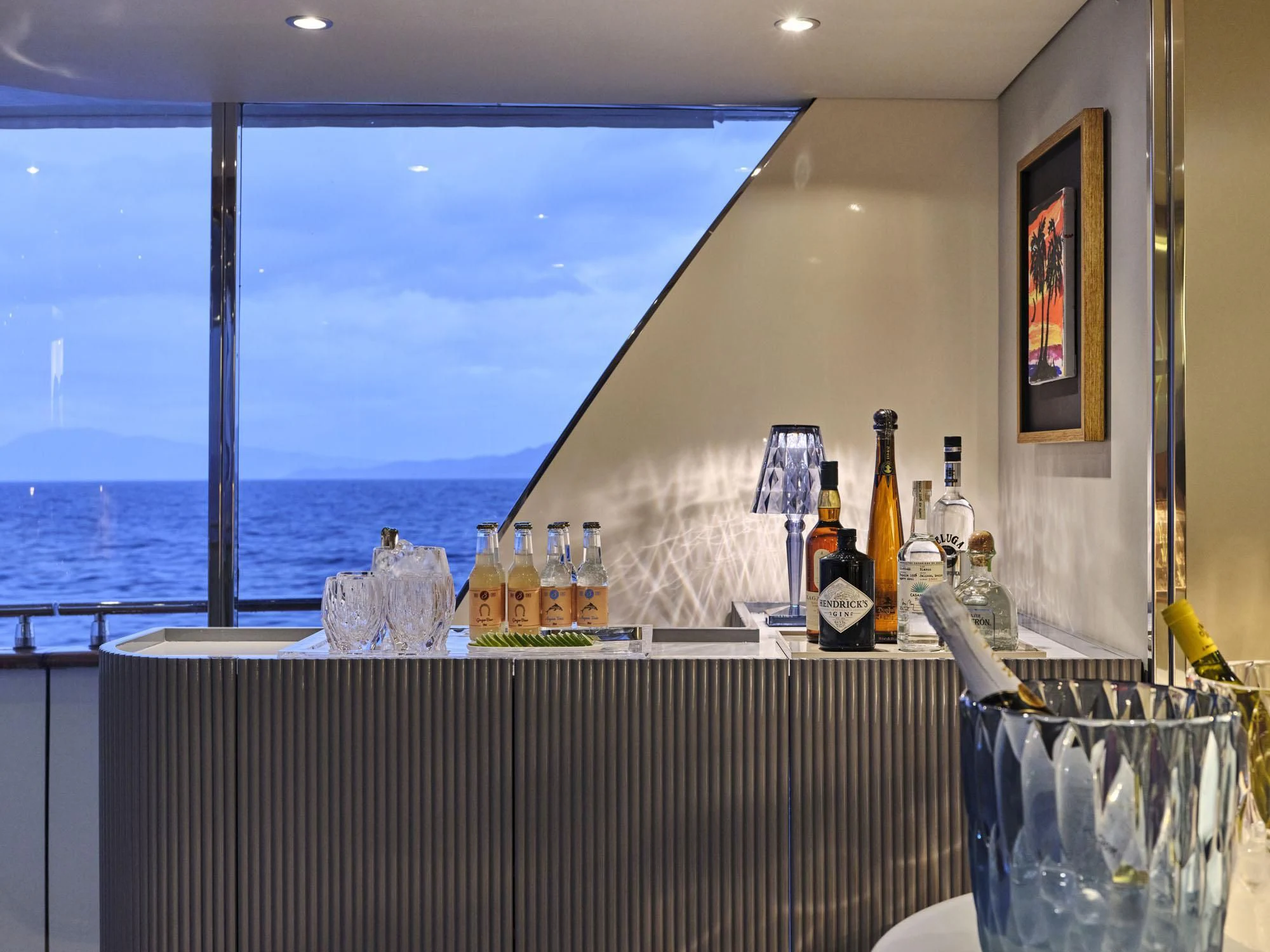 a kitchen with a large window aboard BEYOND Yacht for Charter