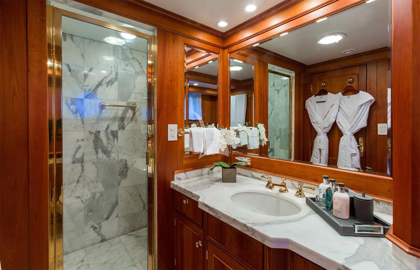 a person taking a picture of himself in a bathroom mirror aboard PIONEER Yacht for Sale
