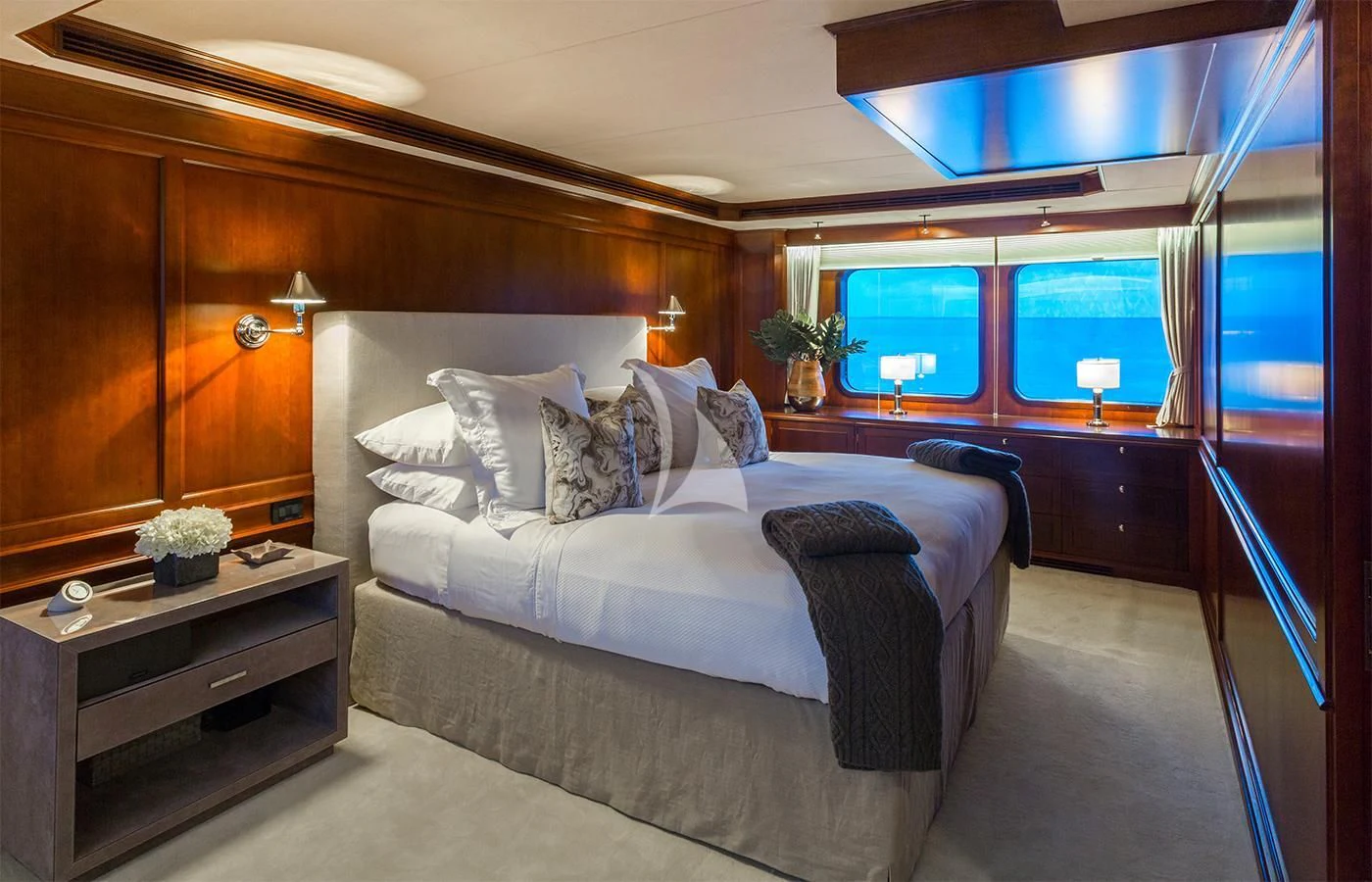 a bedroom with a large bed aboard PIONEER Yacht for Sale