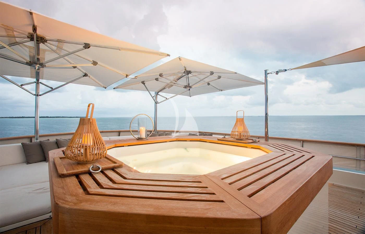 a table with a cloth and a light on it aboard PIONEER Yacht for Sale