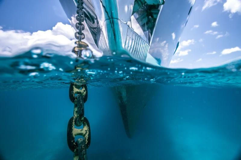 a person from a rope aboard PIONEER Yacht for Sale