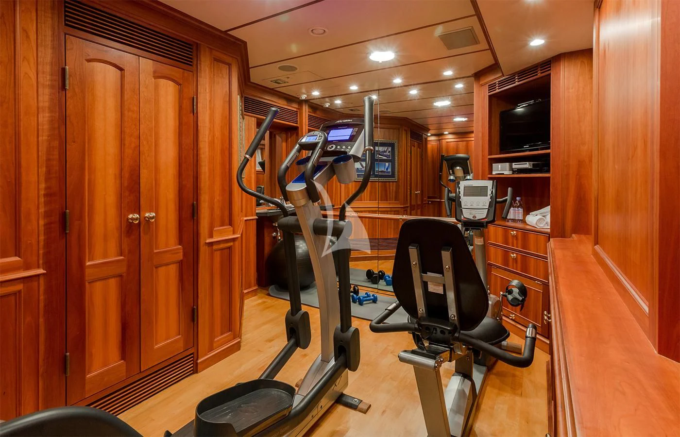 a gym with equipment aboard PIONEER Yacht for Sale