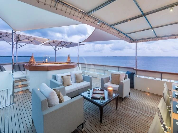 a large living room with a large ocean view aboard PIONEER Yacht for Sale