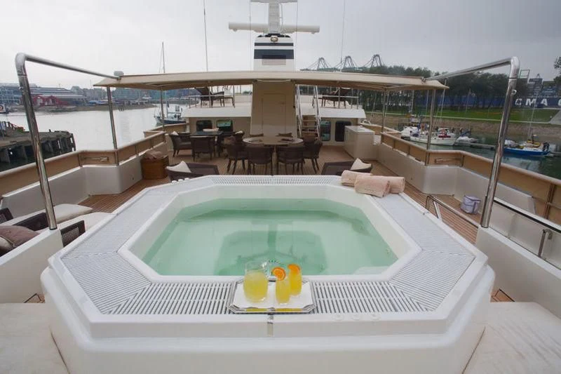 a swimming pool on a deck aboard PIONEER Yacht for Sale