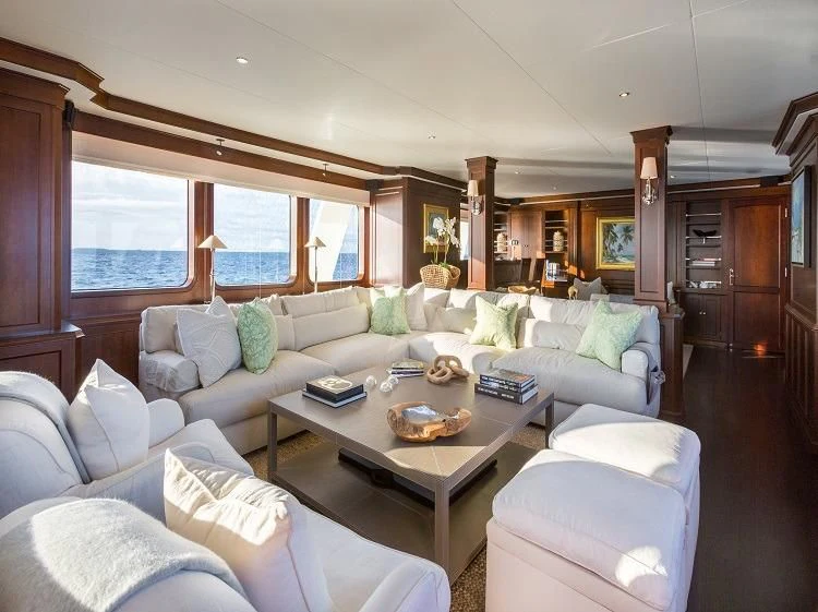 a living room with a large window aboard PIONEER Yacht for Sale