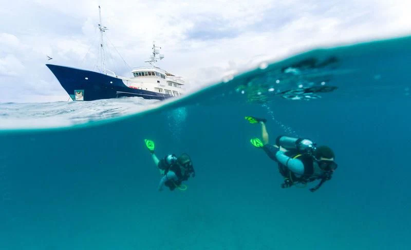 a helicopter flying over a ship aboard PIONEER Yacht for Sale