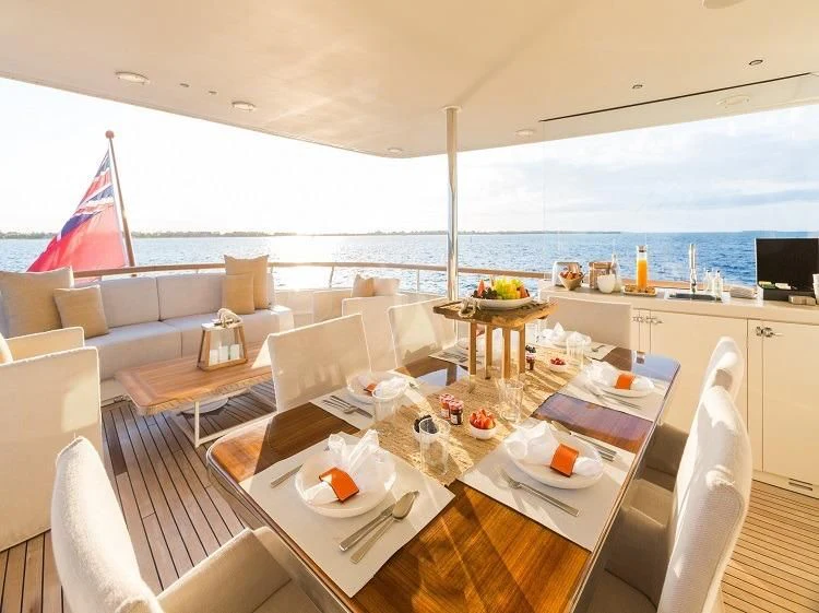 a large white kitchen with a large deck overlooking the ocean aboard PIONEER Yacht for Sale