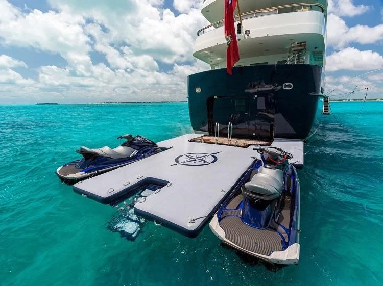 a boat with a motor attached to it in the water aboard PIONEER Yacht for Sale