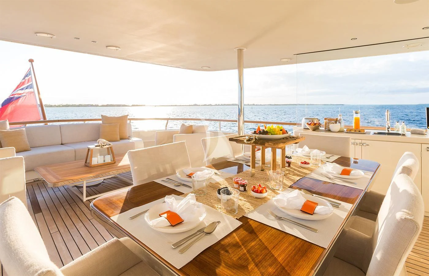 a large room with a table and chairs aboard PIONEER Yacht for Sale