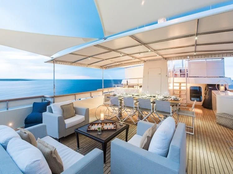 a large living room with a large pool aboard PIONEER Yacht for Sale