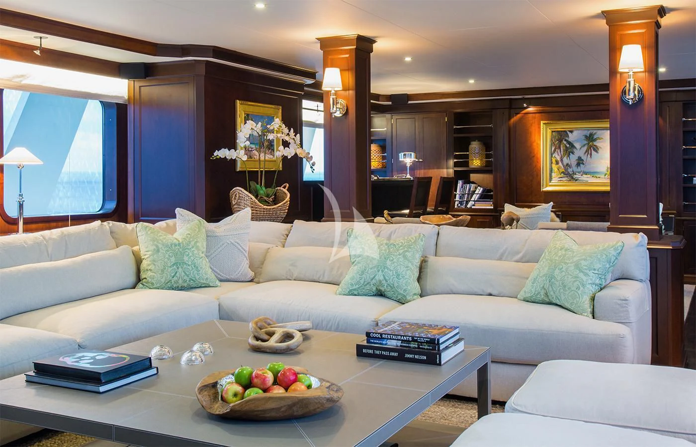 a living room with a couch and a coffee table aboard PIONEER Yacht for Sale