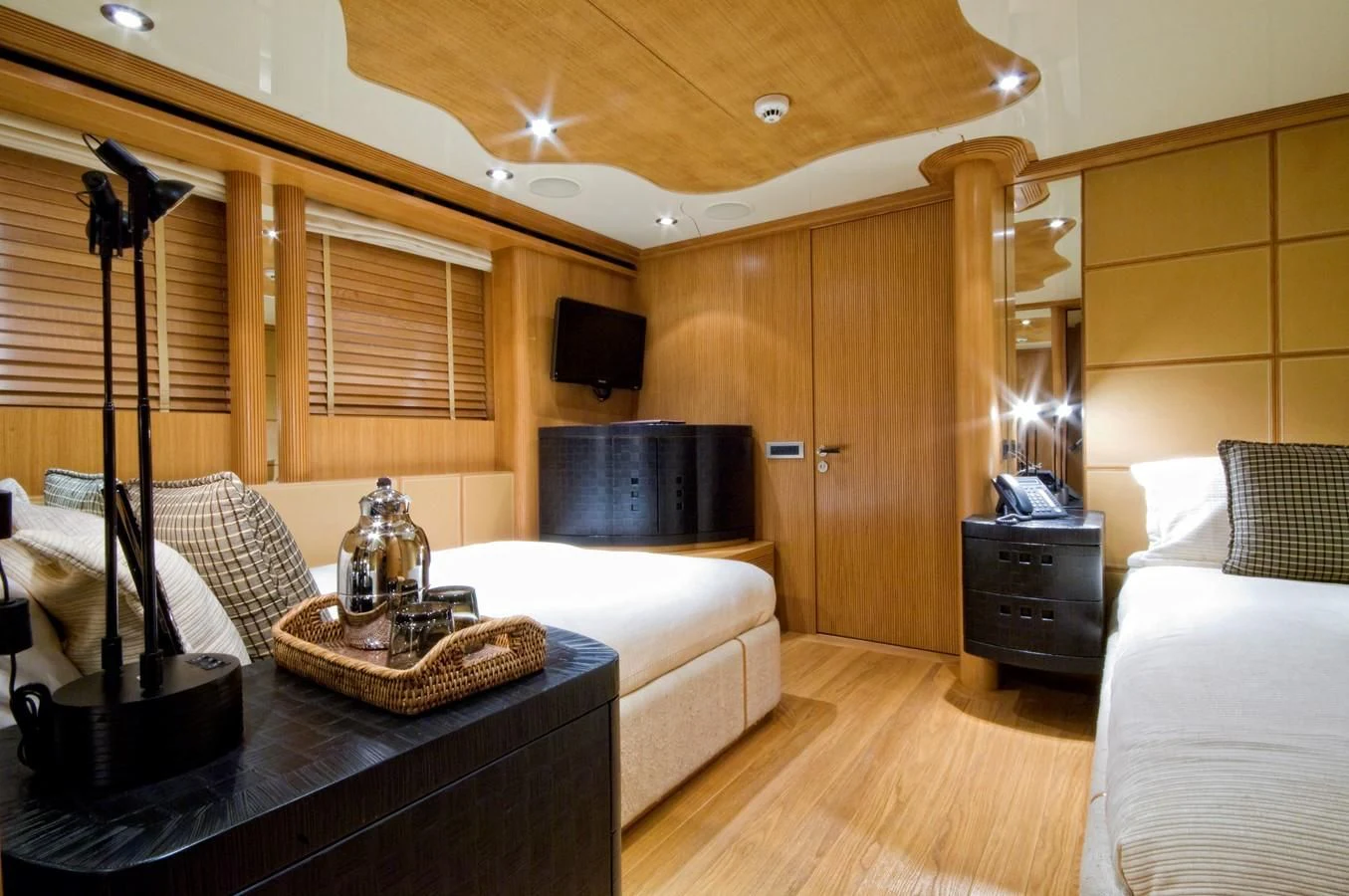 a room with a bed and a table aboard KIJO Yacht for Sale