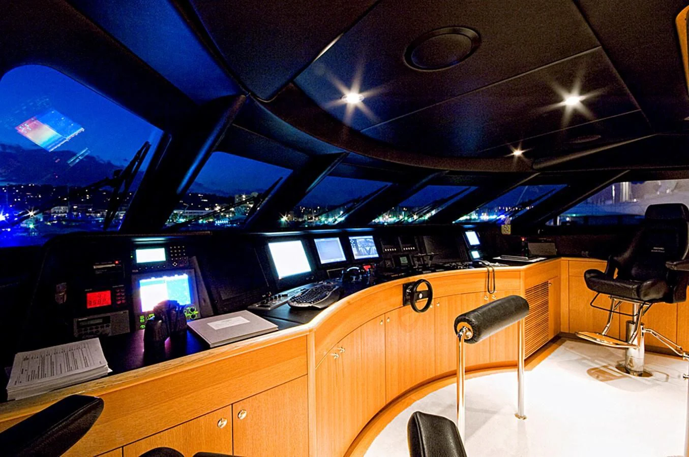 a room with computers and chairs aboard KIJO Yacht for Sale