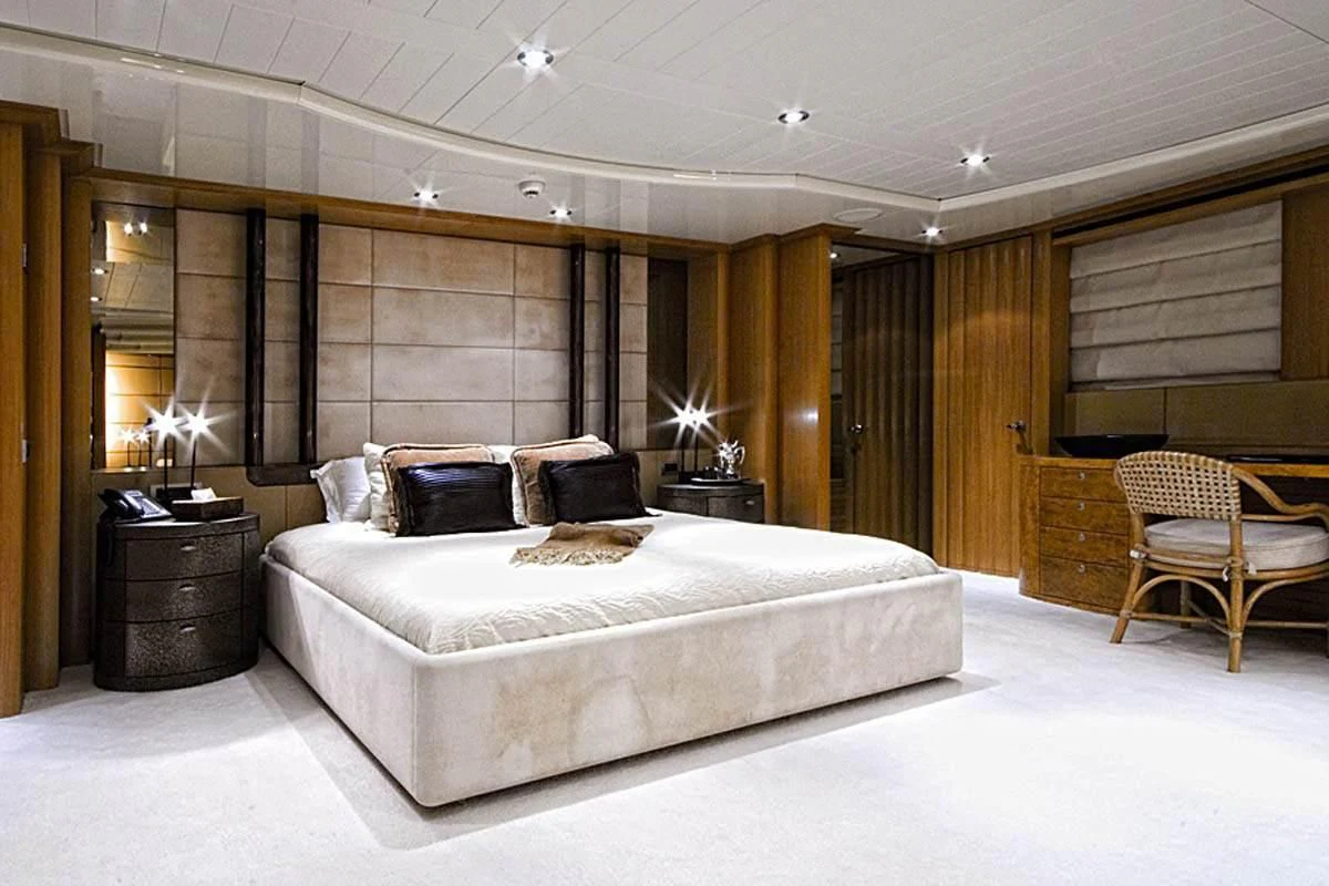 a large bedroom with a large bed aboard KIJO Yacht for Sale