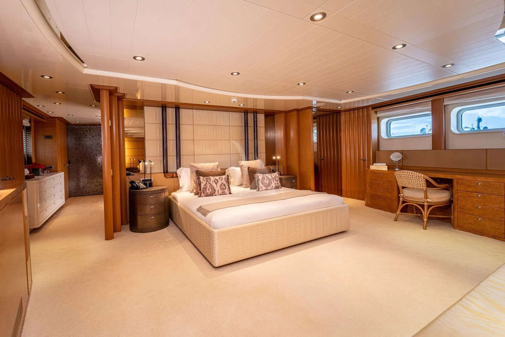 a large bedroom with a large bed aboard KIJO Yacht for Sale