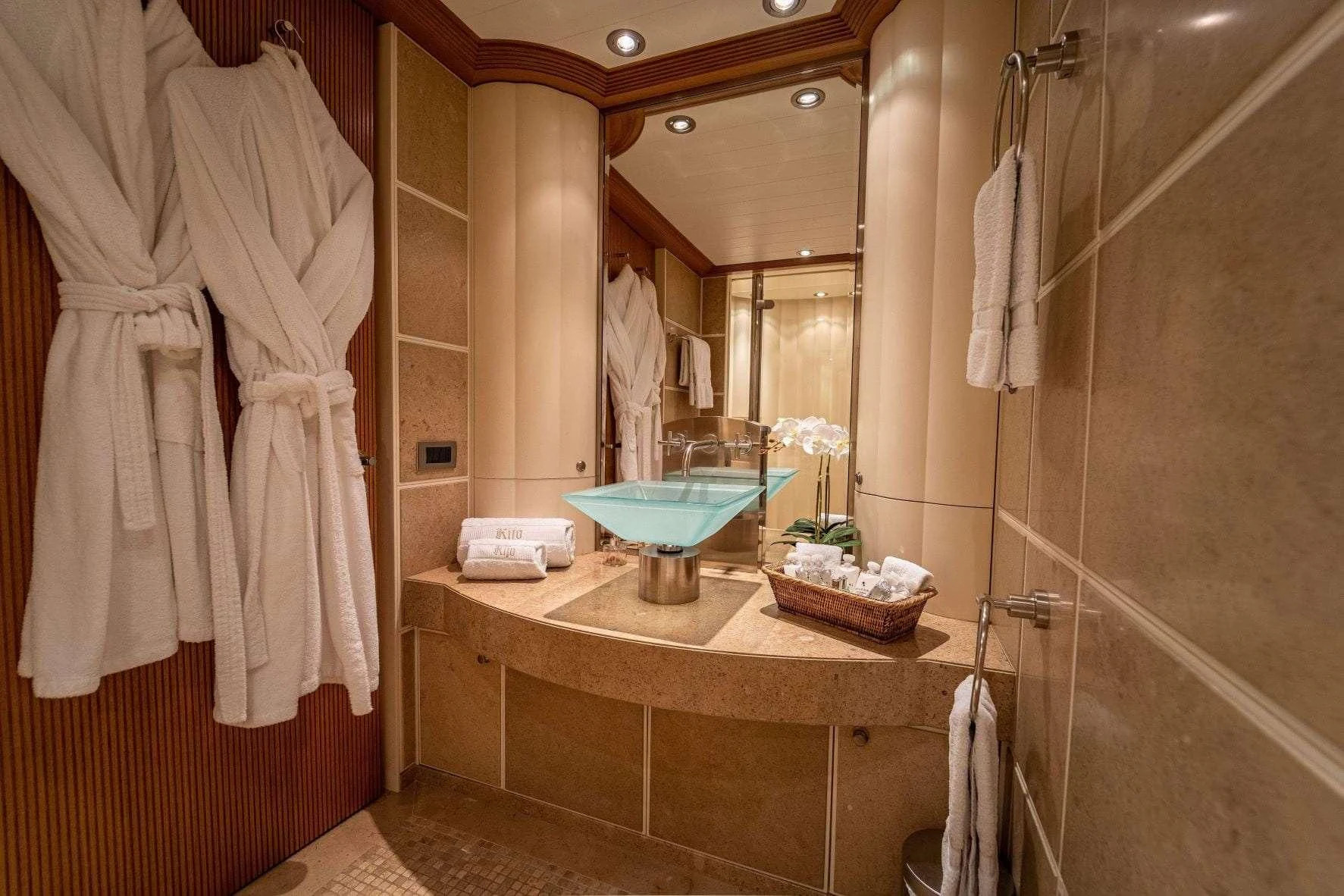 a bathroom with a sink and a mirror aboard KIJO Yacht for Sale