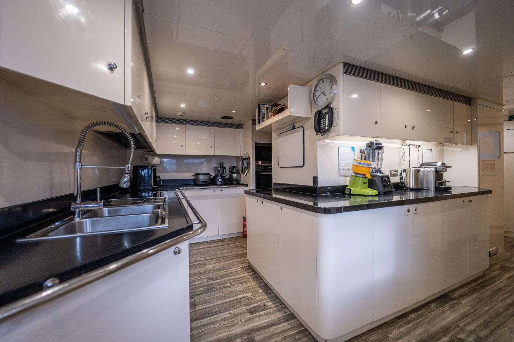 a kitchen with a sink and a microwave aboard KIJO Yacht for Sale