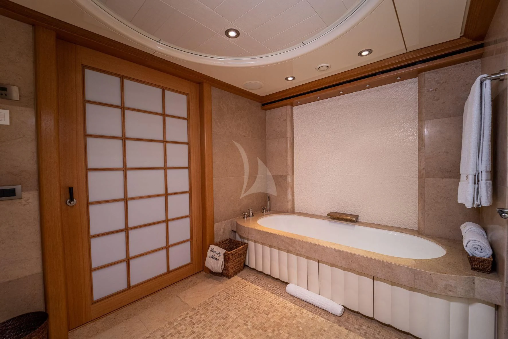 a bathroom with a bathtub and a shower aboard KIJO Yacht for Sale