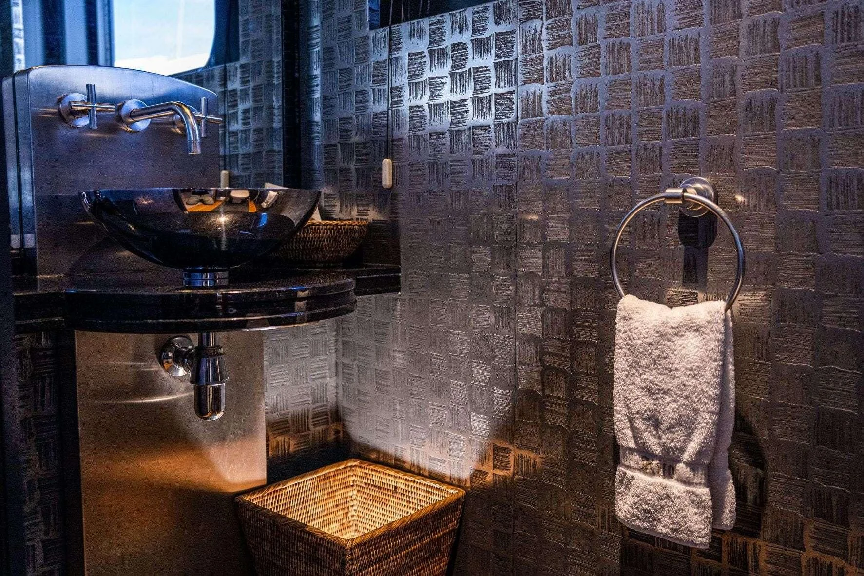 a bathroom with a sink and a mirror aboard KIJO Yacht for Sale
