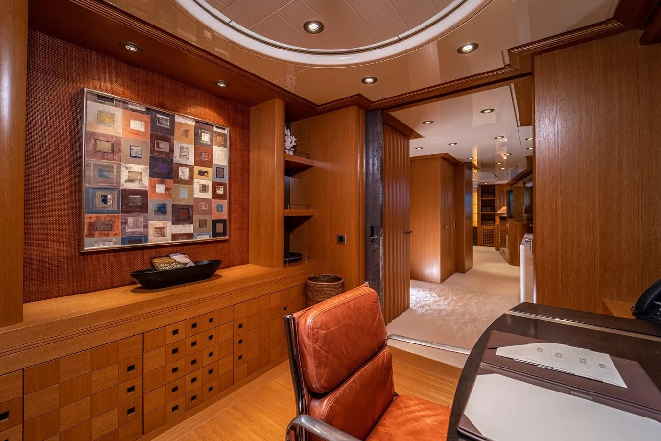 a room with wood cabinets and a desk aboard KIJO Yacht for Sale