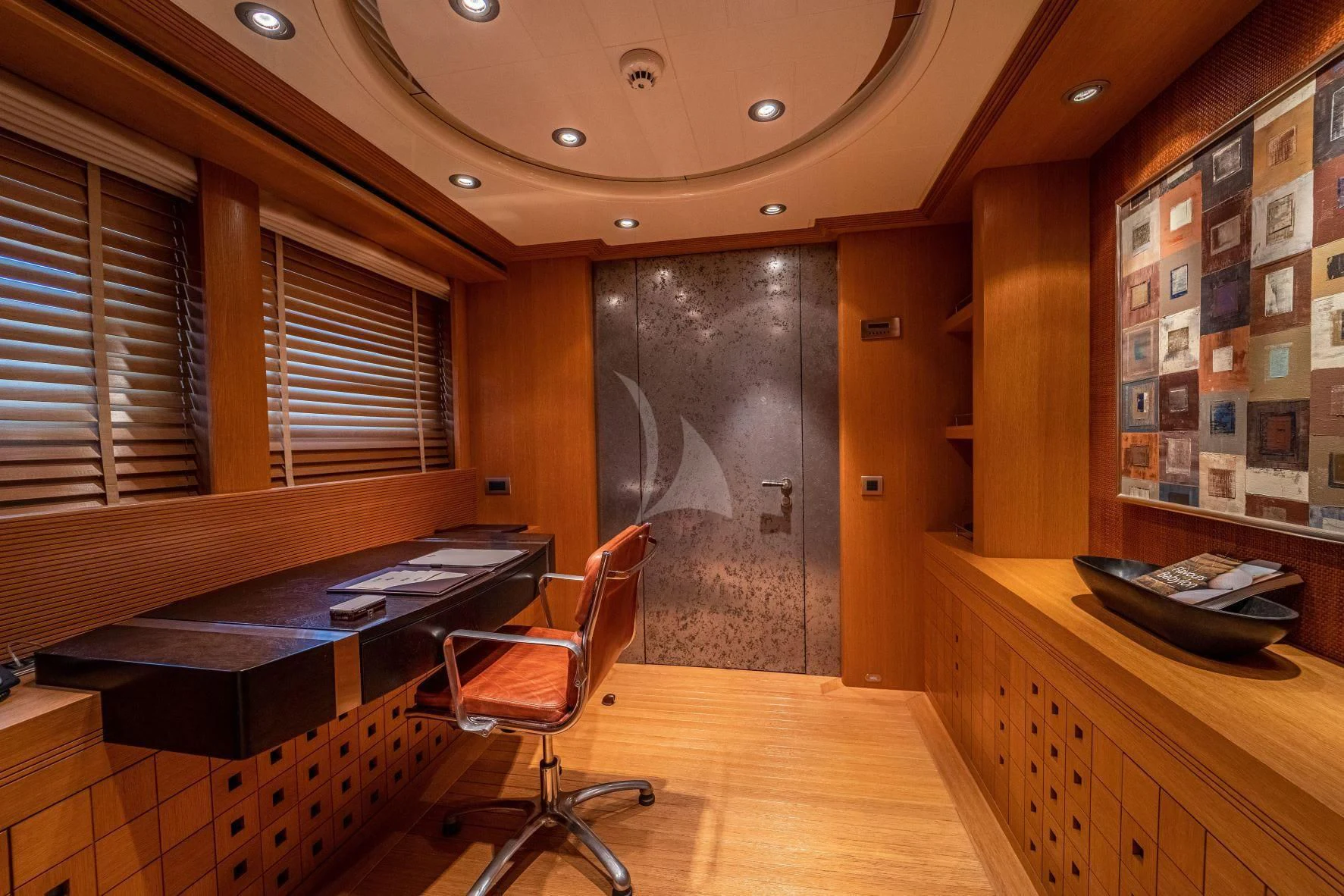 a room with a desk and a chair aboard KIJO Yacht for Sale