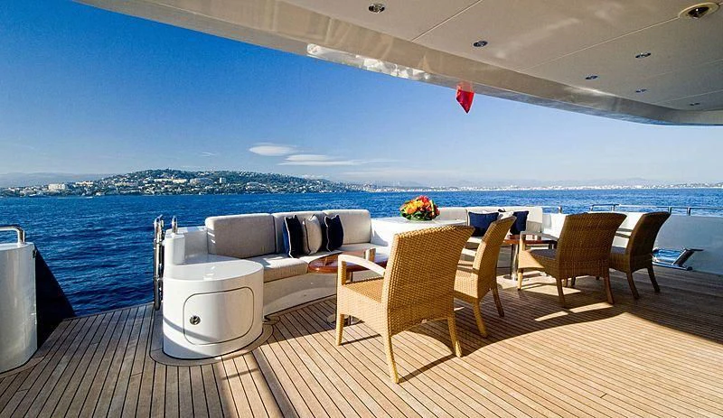 a deck with chairs and a couch aboard KIJO Yacht for Sale