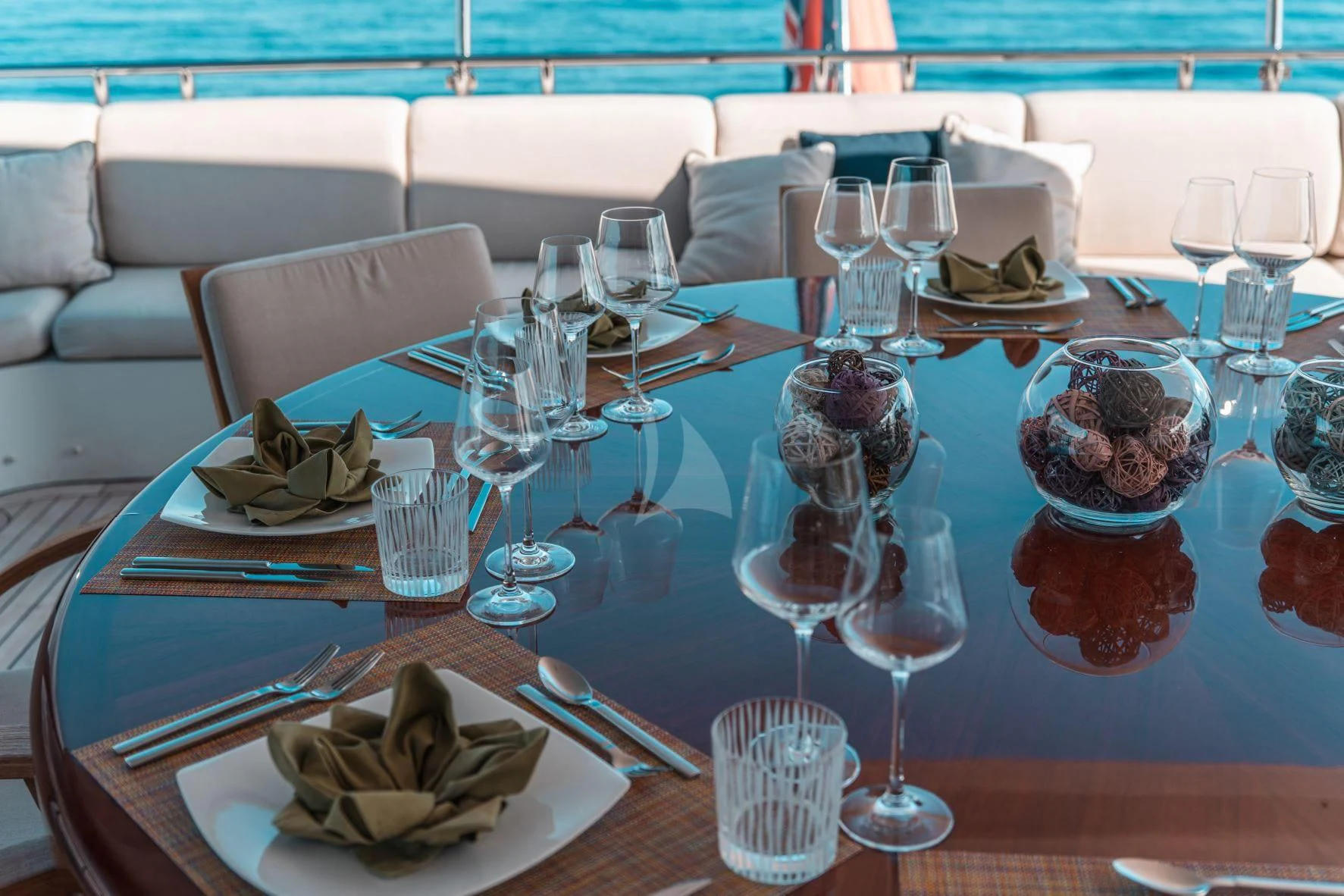 a table set with food and wine glasses aboard KIJO Yacht for Sale