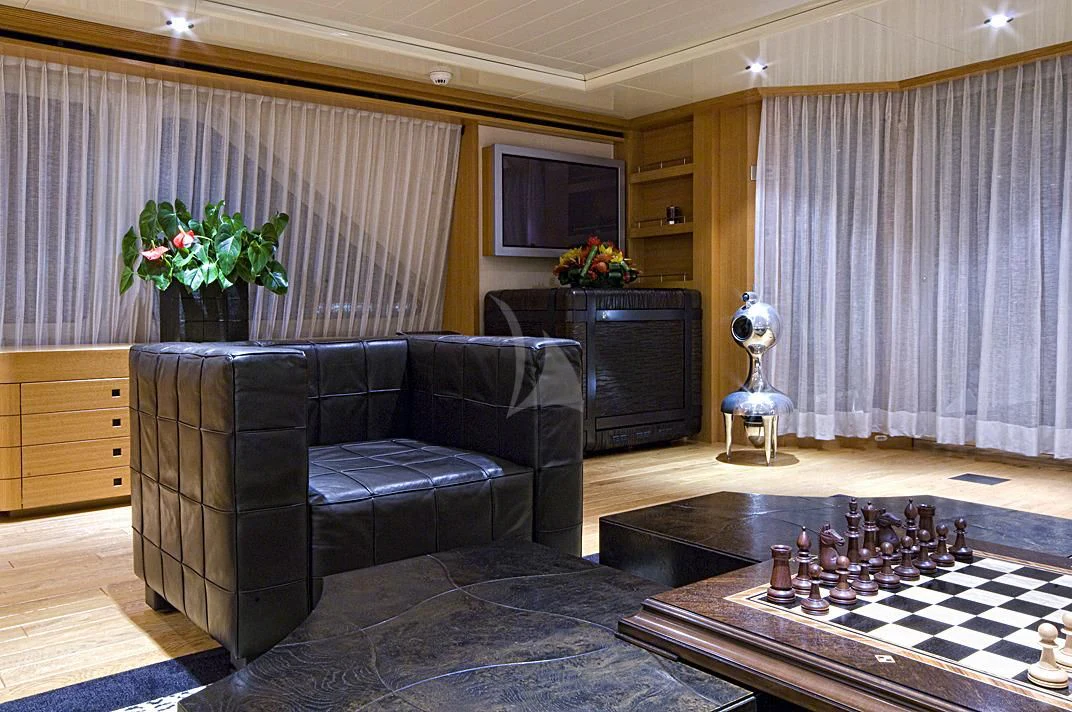 a living room with a couch and a coffee table aboard KIJO Yacht for Sale